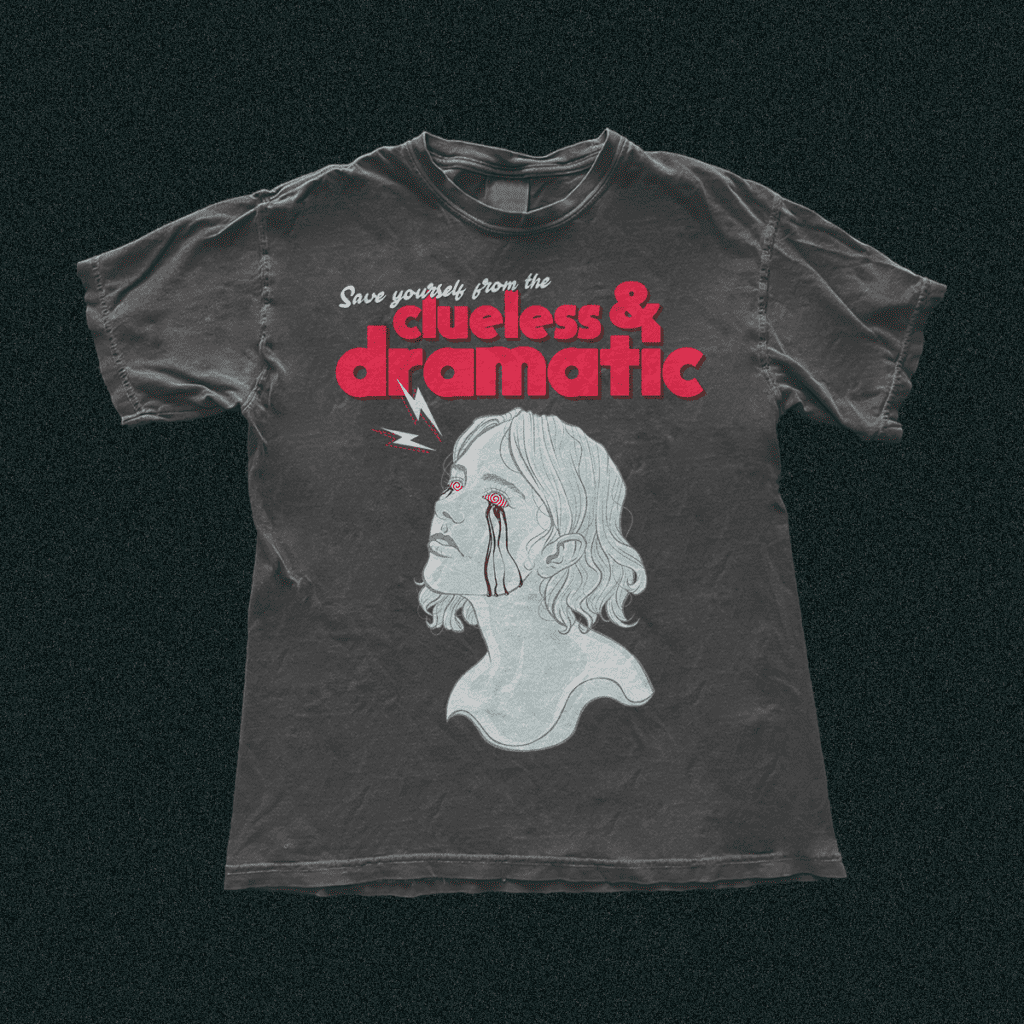Image of Clueless & Dramatic poster design on a grey t-shirt